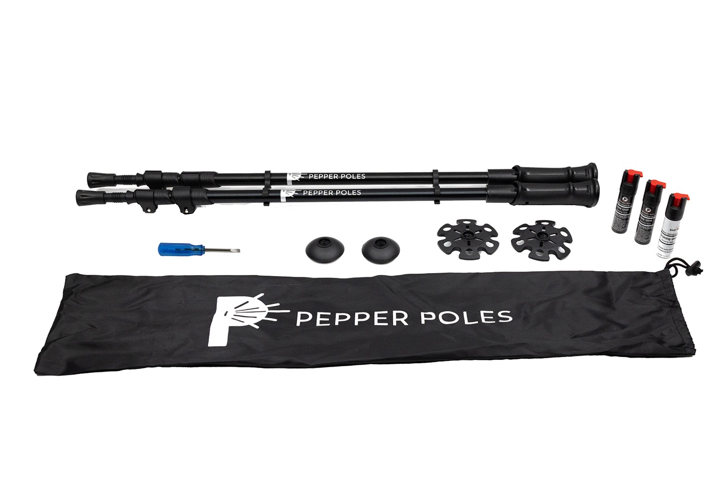 The full Pepper Poles kit laid out: two poles, three spray canisters, baskets, rubber feet, adjustment tool and carry bag